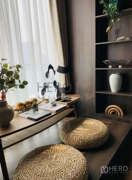 Condominium for rent - Decorated shelving and woven floor cushions beside the Zen balcony window.
