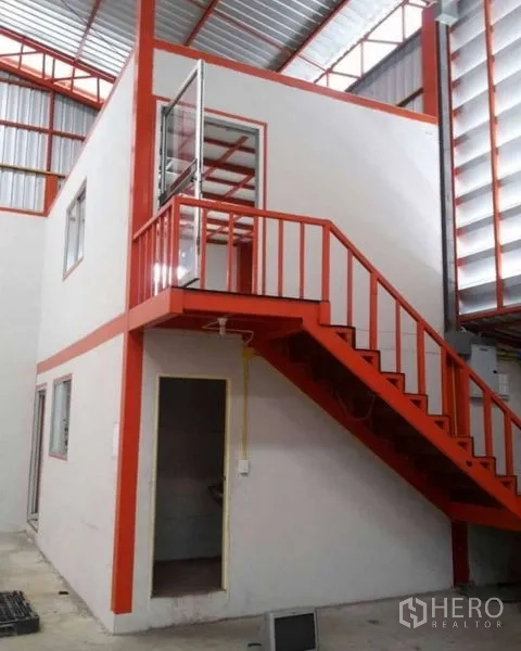 Warehouse for rent in Bang Phli, Samut Prakan - Close-up of internal two-storey office with orange stair and glass door