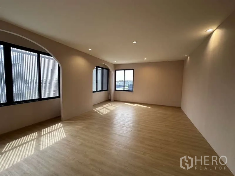Factory for rent in Lam Luk Ka, Pathum Thani - Another view of arched office showing recessed lighting and wood floors.