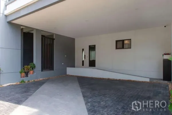 Detached House for rent or sale in Kanchanaburi - Spacious covered carport with ramp and tiled driveway leading to the home.