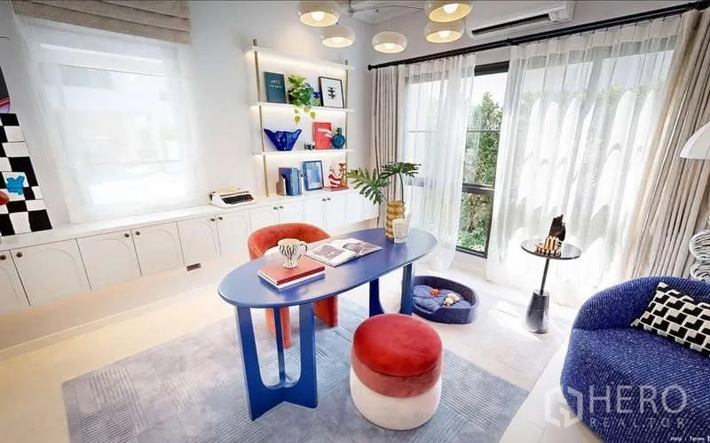 Detached House for rent in Bang Phli, Samut Prakan - Home office or creative studio with blue desk, built-in shelving, pendant lights and garden views.