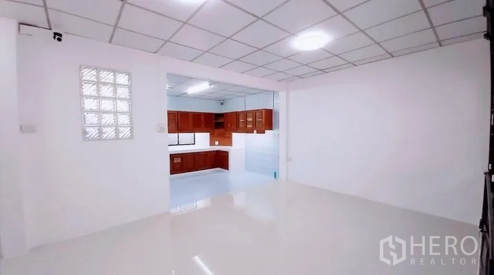 Townhouse for sale - Dining or family area connecting to an L-shaped kitchen.