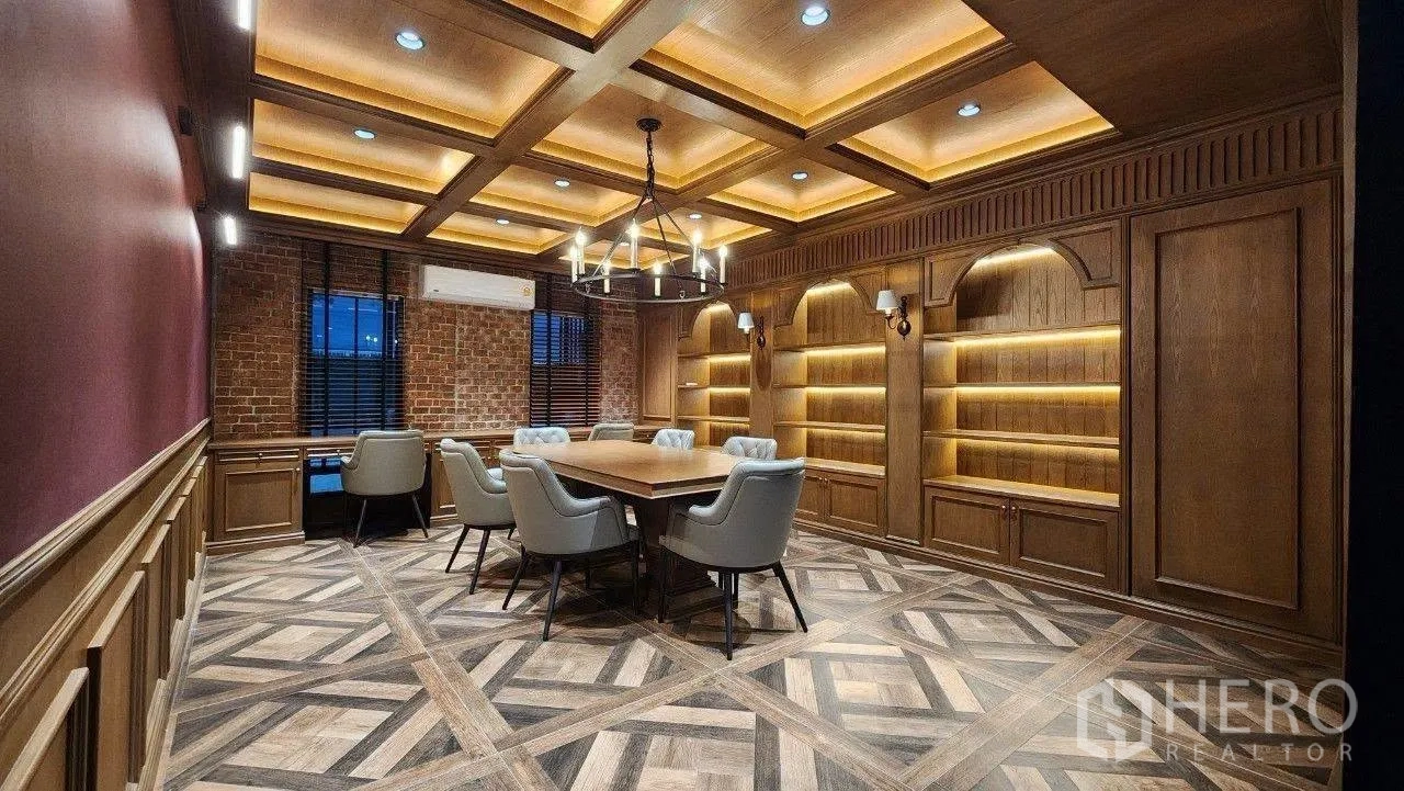 Home Office for rent in Lat Phrao, Bangkok - Large boardroom with coffered ceiling, illuminated shelving and wood floors.