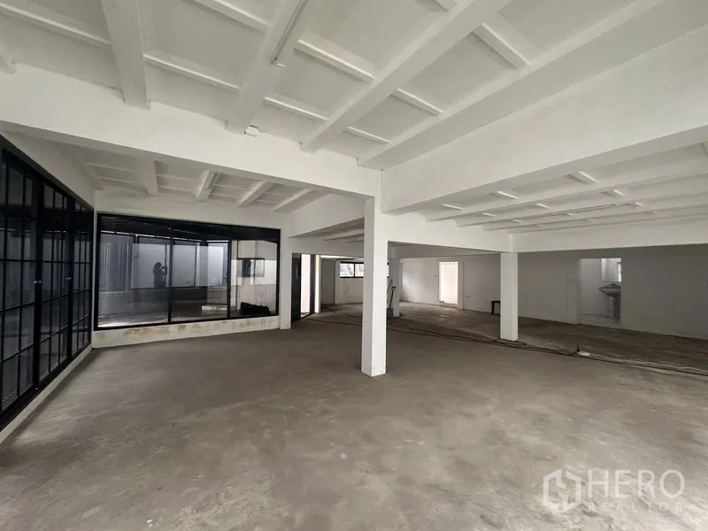 Home Office for rent or sale in Bang Na, Bangkok - Large open workspace with wraparound windows and polished concrete floor.