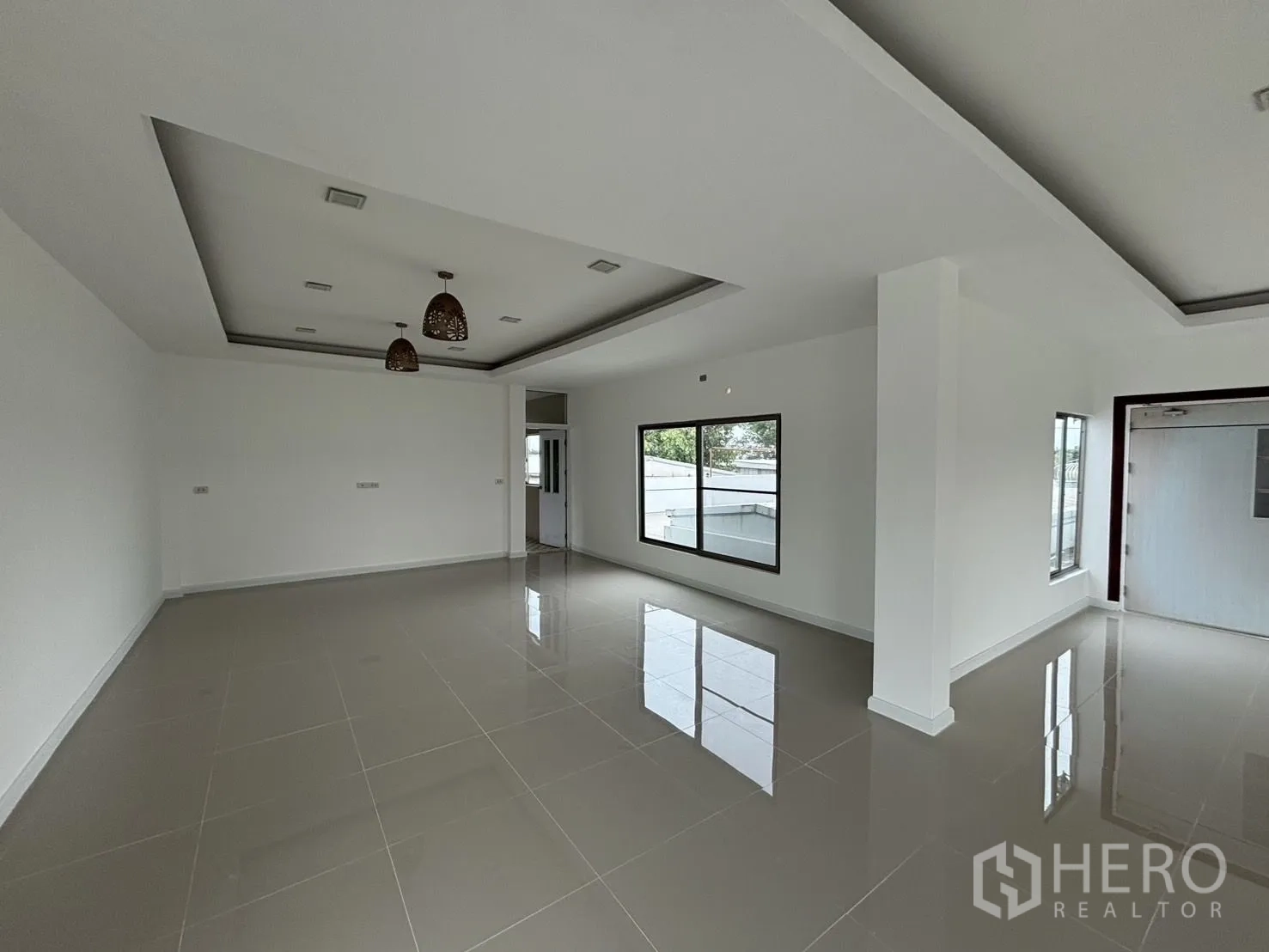 Warehouse for rent or sale in Wang Thonglang, Bangkok - Bright multipurpose room with glossy floor tiles and recessed ceiling lights.