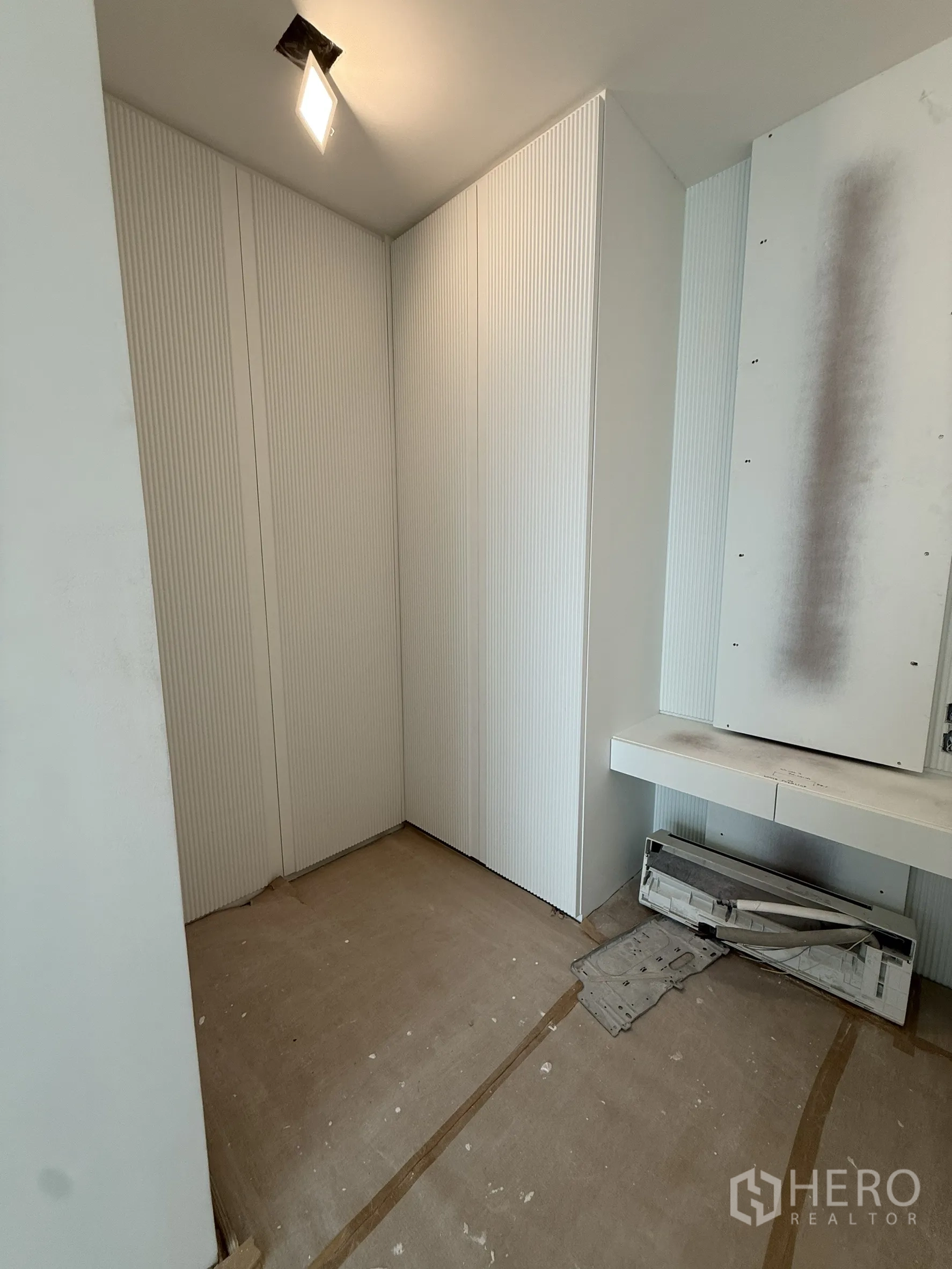 Detached House for sale in Bang Phli, Samut Prakan - Small white utility or cloak room with paneled walls in progress.