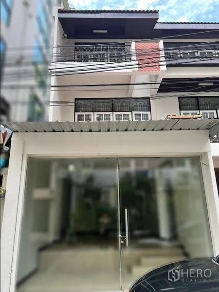 Retail Space for rent in Watthana, Bangkok - Ground-floor glass-front retail entrance on a three-storey building with street frontage and natural light.