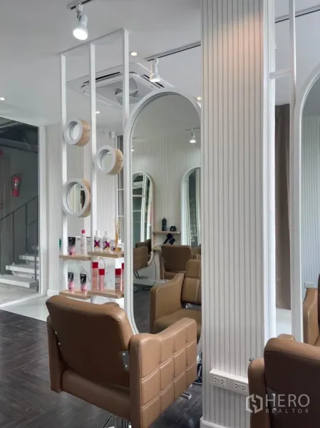 Retail Space for rent in Khlong Toei, Bangkok - Modern retail space with styling chairs, ribbed white walls and track lighting.
