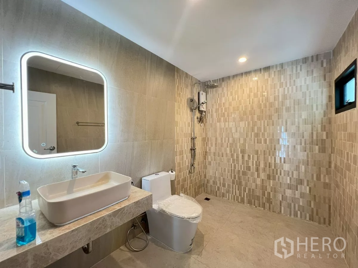 Detached House for rent in Suan Luang, Bangkok - Large bathroom with walk-in shower, backlit mirror, and water heater.