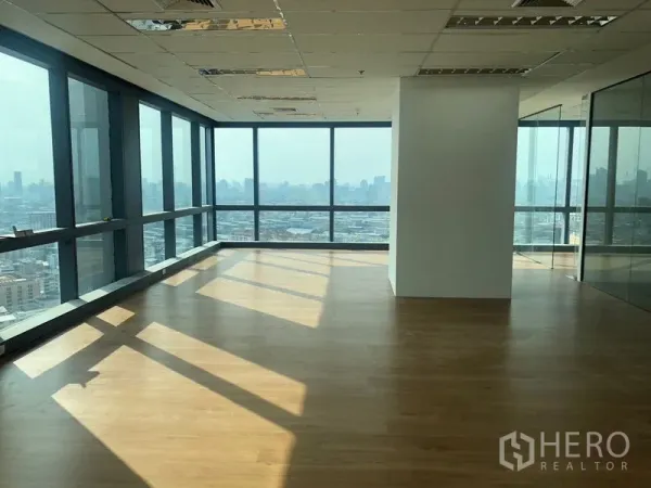 Office Space for rent in Din Daeng, Bangkok - Corner office with floor-to-ceiling windows, wood flooring, and panoramic Bangkok skyline views.