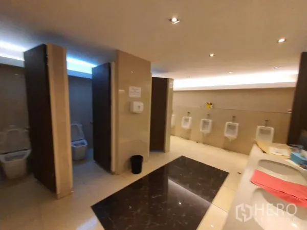 Office Space for rent in Watthana, Bangkok - Men’s restroom with stalls, urinals and vanity inside a Bangkok office building.