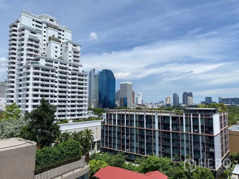 Condominium for rent in Khlong Toei, Bangkok - City skyline and neighboring condominium buildings viewed from the balcony.
