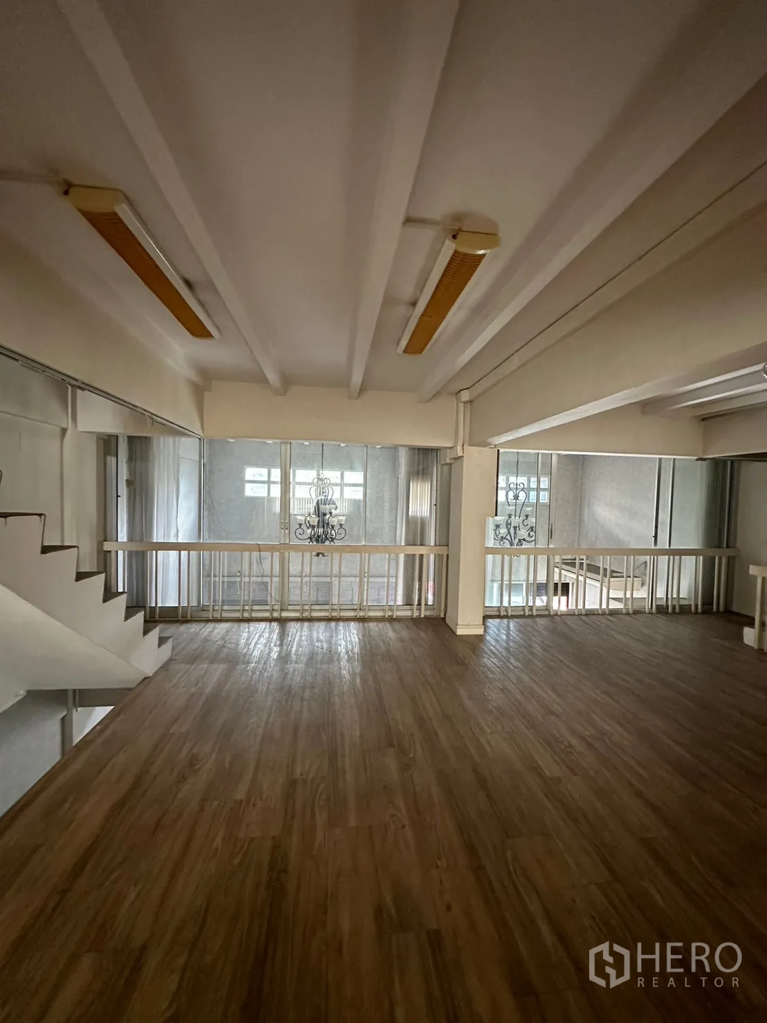 Retail Space for rent in Watthana, Bangkok - Large mezzanine workspace with wood floors and railing