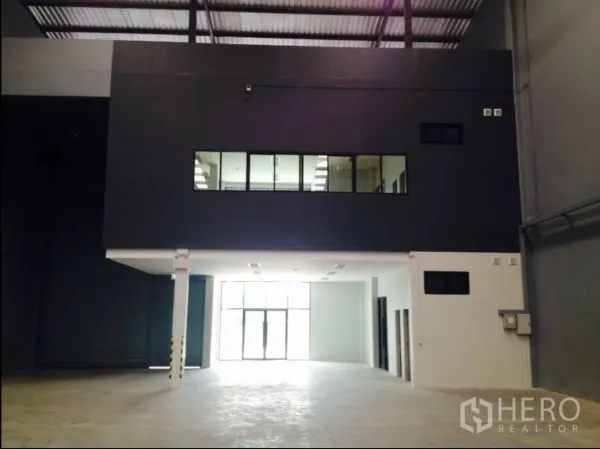 Factory for rent in Samut Prakan - Close view of mezzanine office with windows overlooking the main production floor.