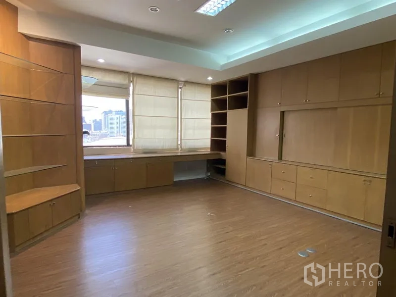 Office Space for rent in Din Daeng, Bangkok - Private office with built-in desks under windows and city view.