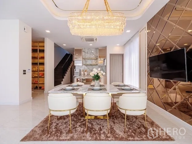 Detached House for sale in Prawet, Bangkok - Open-plan dining and pantry kitchen with marble accents and gold details.