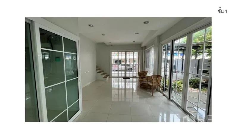 Home Office for rent - Open ground-floor workspace with large sliding doors and staircase to upper levels.