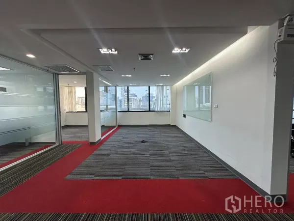 Office Space for rent in Watthana, Bangkok - Open workspace with glass partitions, wall-mounted whiteboard and high-floor city views.