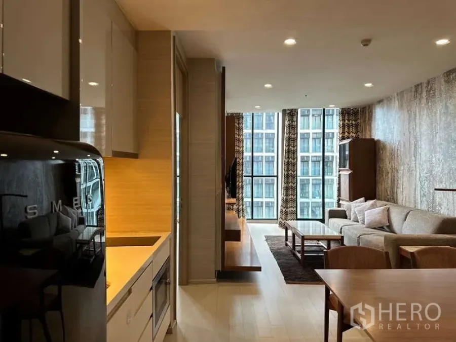 Condominium for rent or sale - Kitchen and living space corridor view toward windowed sitting area.