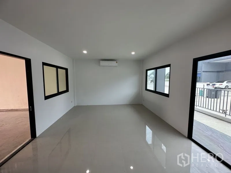 Factory for rent or sale in Bang Yai, Nonthaburi - Ground-floor office with air-conditioning, glass doors and stairs to mezzanine.
