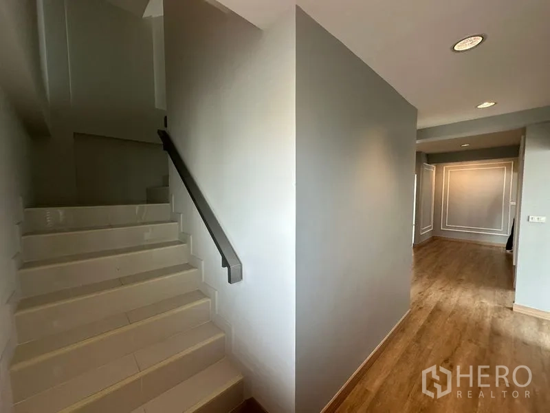 Home Office for rent in Suan Luang, Bangkok - Internal staircase with tiled steps beside open office area.