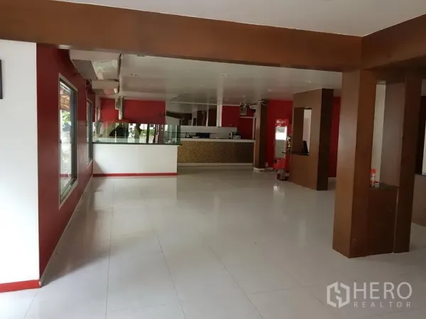 Retail Space for rent in Watthana, Bangkok - Spacious open-plan retail area with service counter and large windows.