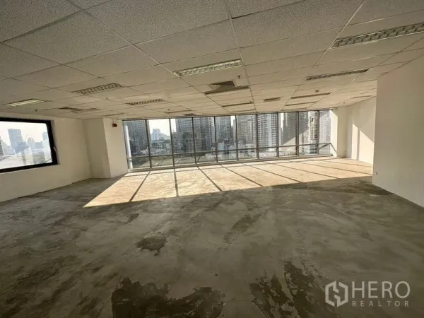 Office Space for rent - Sunlit vacant office space with panoramic glazing and concrete subfloor ready for fit-out.