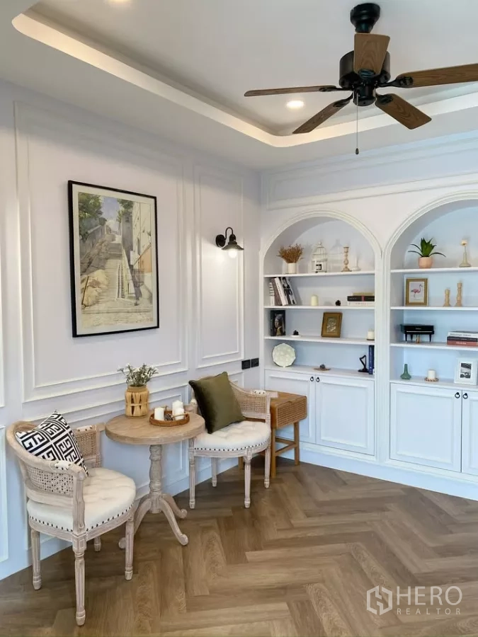 Detached House for sale in Sai Mai, Bangkok - Reading room with ceiling fan, arched shelving and decorative wall moulding.