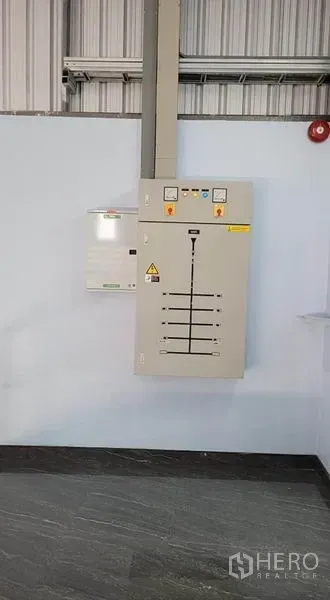 Factory for rent or sale in Phanat Nikhom, Chon Buri - Main electrical distribution board and control panel mounted on an interior wall.