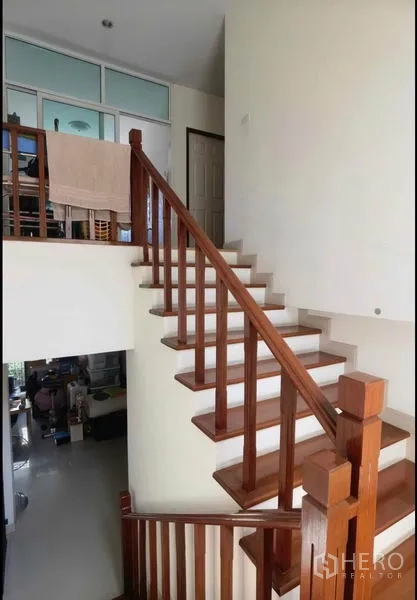 Detached House for sale in Bang Yai, Nonthaburi - Wooden staircase with open landing connecting the two floors.