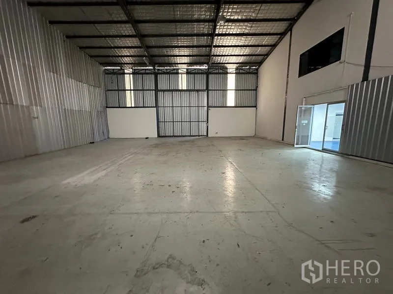 Office Space for rent - Warehouse interior showing entrance doors and link to office zone.