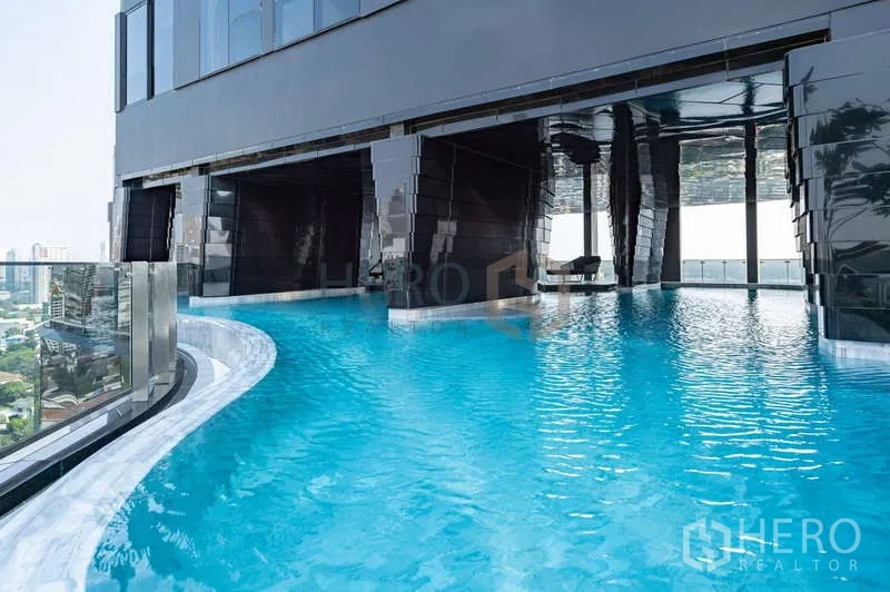 Condominium for rent - Infinity-edge swimming pool with city views at the high-rise condominium.