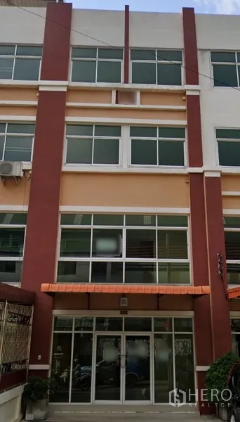 Home Office for rent in Yan Nawa, Bangkok - Multi-storey home office exterior with large windows and an orange awning in Yan Nawa, Bangkok.