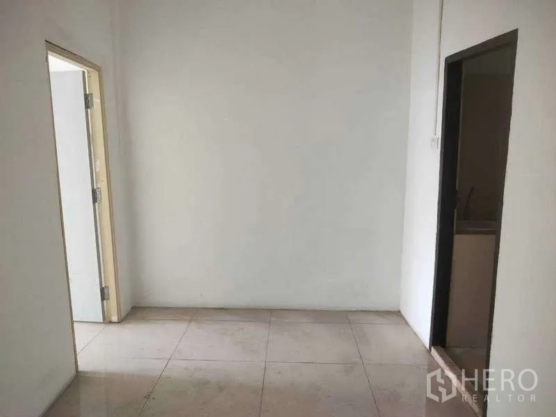 Shophouse for sale in Phra Khanong, Bangkok - Small room with a doorway leading to a pantry or utility area.