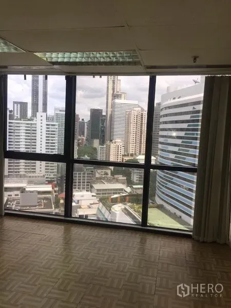 Office Space for rent in Watthana, Bangkok - Office area with large windows showcasing Bangkok skyline city views.