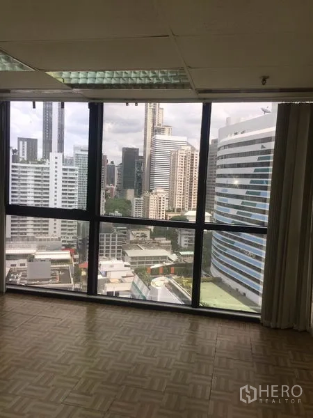 Office Space for rent in Watthana, Bangkok - Office area with large windows showcasing Bangkok skyline city views.