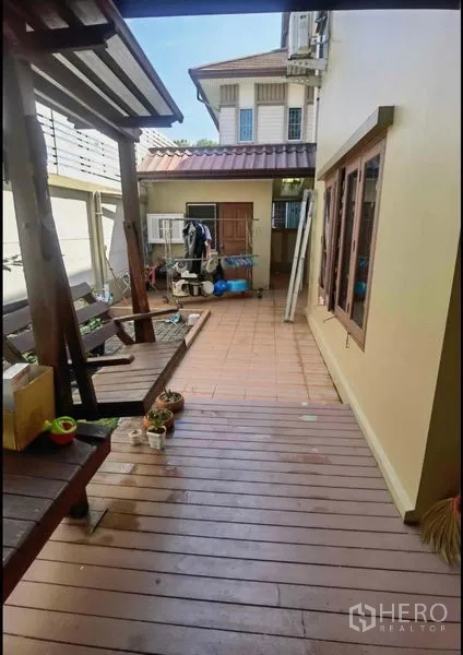 Detached House for sale in Bang Yai, Nonthaburi - Rear deck and patio area with utility room and storage.