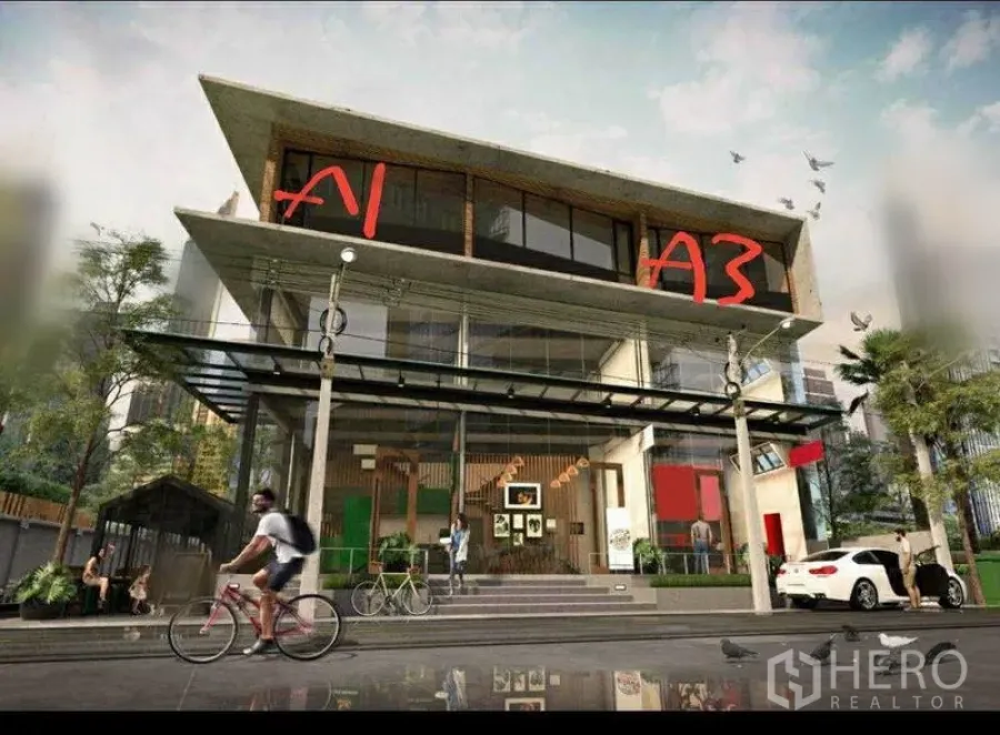 Retail Space for rent in Watthana, Bangkok - Modern three-storey retail building with wide glass frontage and signage in the Sukhumvit area of Bangkok.