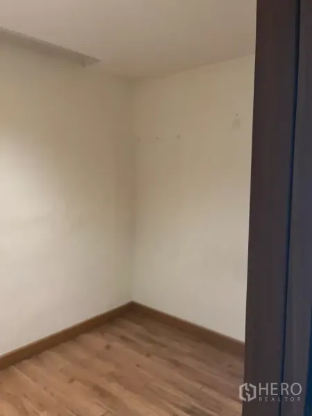 Office Space for rent - Corner workspace with wood floor and blank walls ready for fit-out.