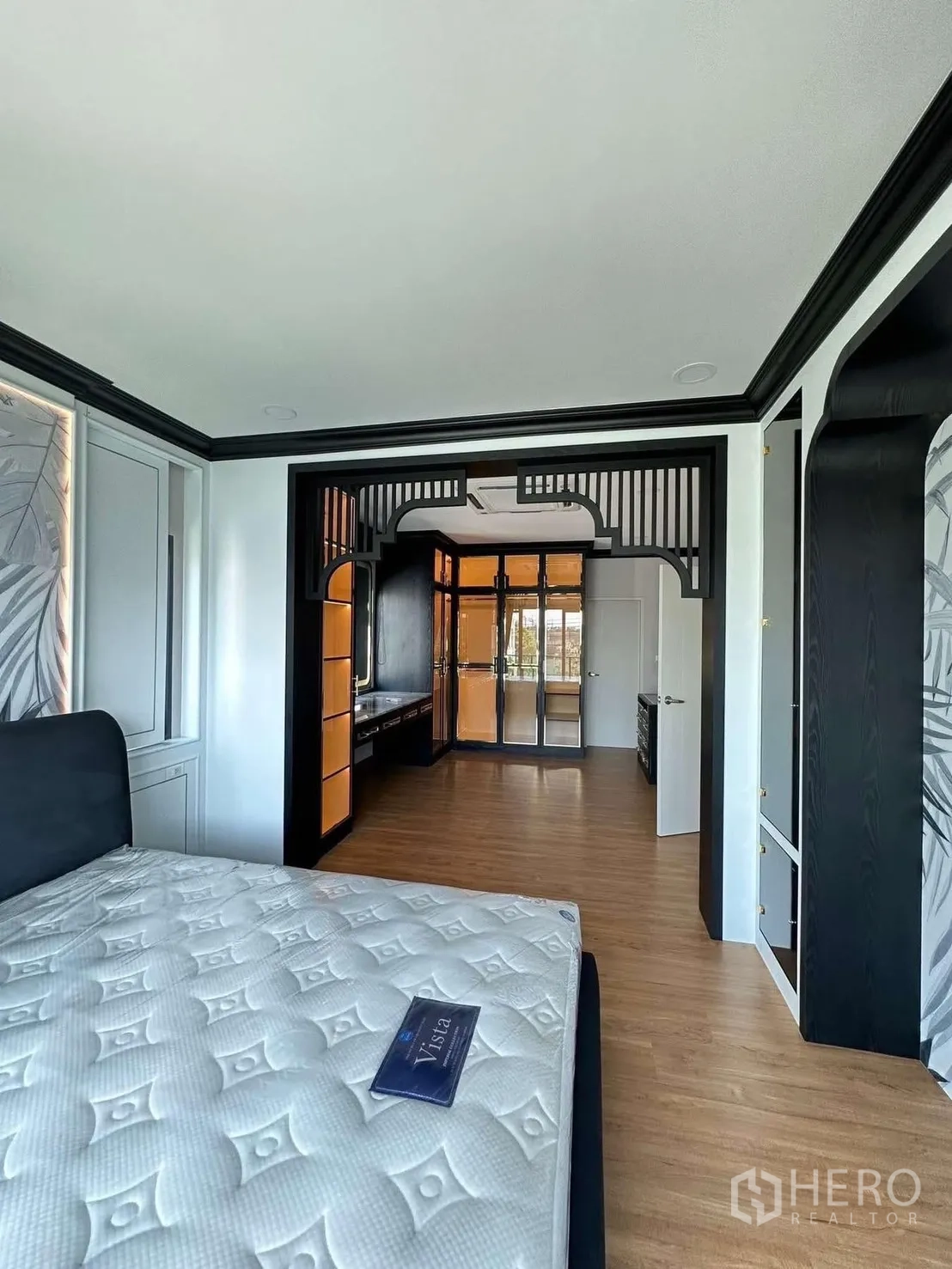 Detached House for rent in Bang Phli, Samut Prakan - Primary bedroom looking into the spacious closet room with island and cabinetry.