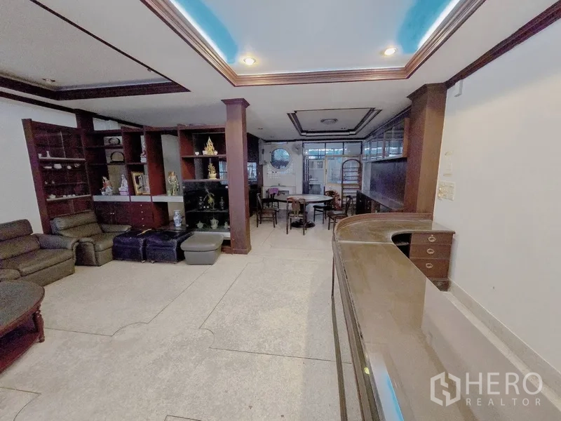 Home Office for rent in Sathon, Bangkok - Ground-floor lobby with built-in wood shelving, seating and space ideal for reception.