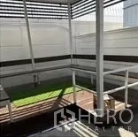 Home Office for rent in Wang Thonglang, Bangkok - Covered terrace with slatted roof, railings and artificial grass.
