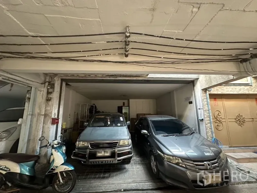 Home Office for rent in Sathon, Bangkok - Covered garage with parking space for two cars and a motorbike.