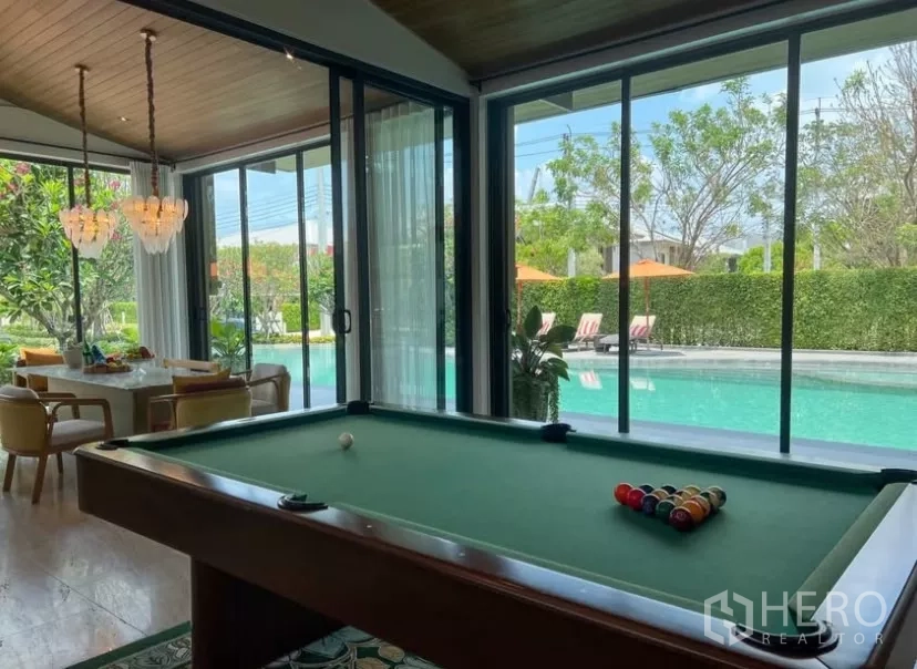 Detached House for rent or sale in Bang Kapi, Bangkok - Clubhouse games room with a pool table opening to the pool terrace.