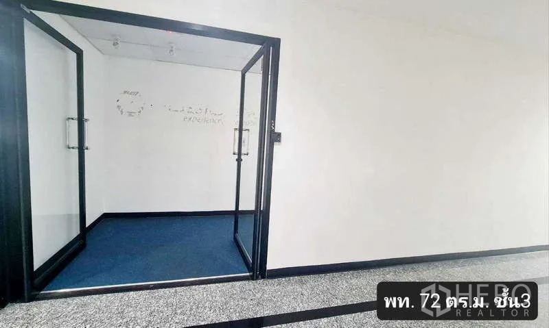 Office Space for rent in Khlong Toei, Bangkok - Glass double doors opening to a small lobby with blue carpet in a Sukhumvit office building.