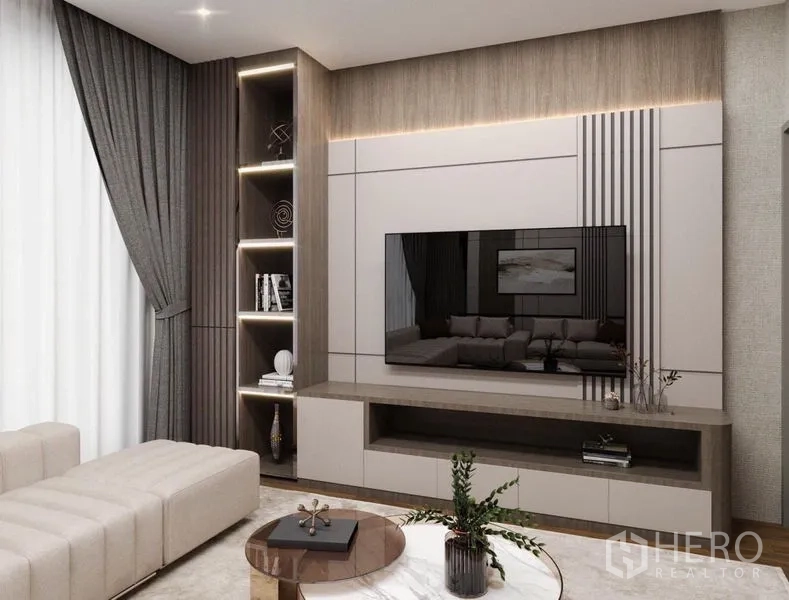 Detached House for sale in Suan Luang, Bangkok - Media wall with built-in shelving, soft strip lighting and a flat-screen TV in a cozy lounge.