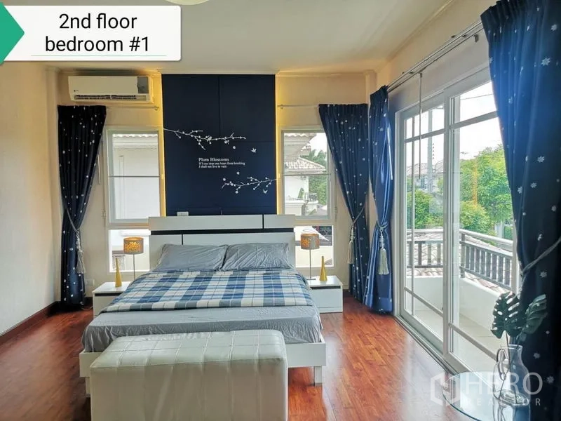 Detached House for rent - Master bedroom facing balcony with blue drapes, sliding glass doors and wood floors.