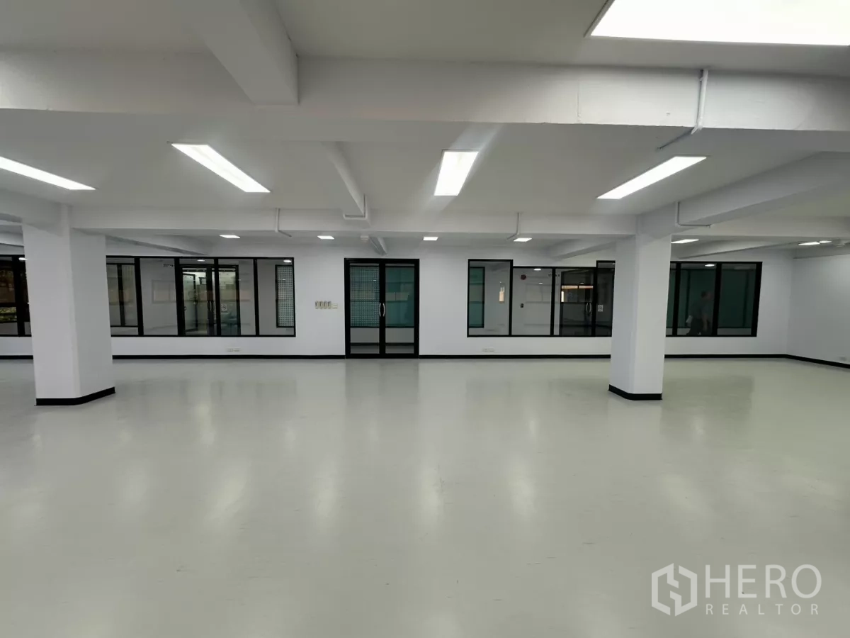 Office Space for rent - Clean ready-to-move-in office showing glass entrance doors and white vinyl flooring.