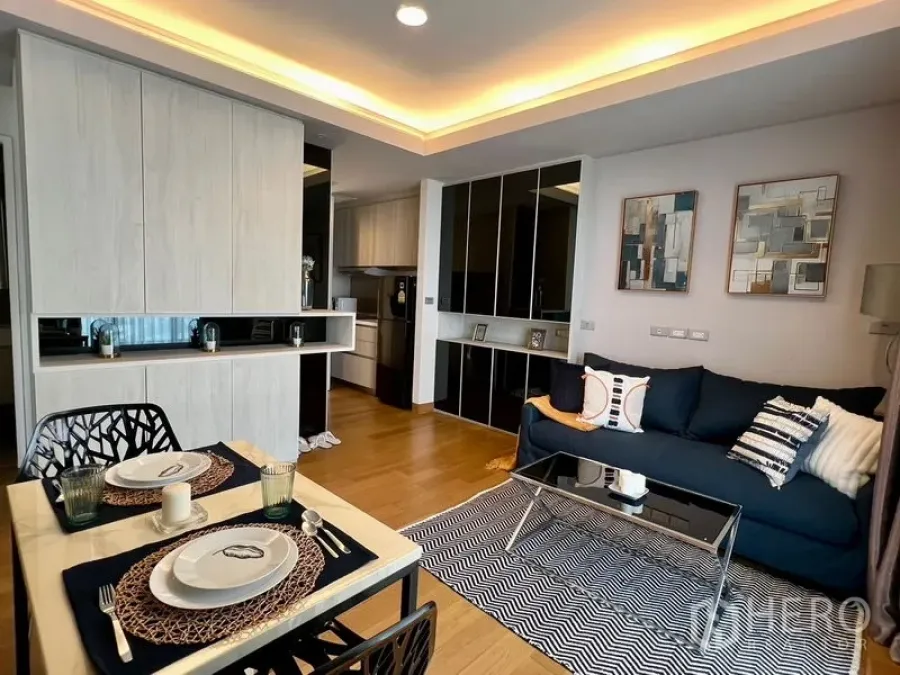 Condominium for rent - Dining table set for two beside the living area and kitchenette in a contemporary condo.