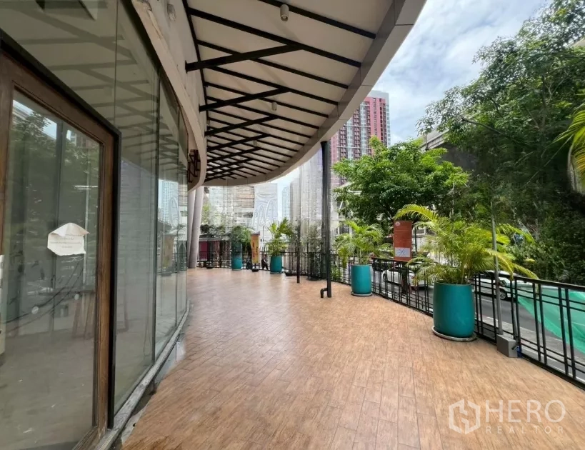 Retail Space for rent - Spacious outdoor terrace with planters and city views near BTS Phra Khanong.